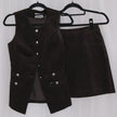Chocolate corduroy vest and skirt set on hangers against a white background