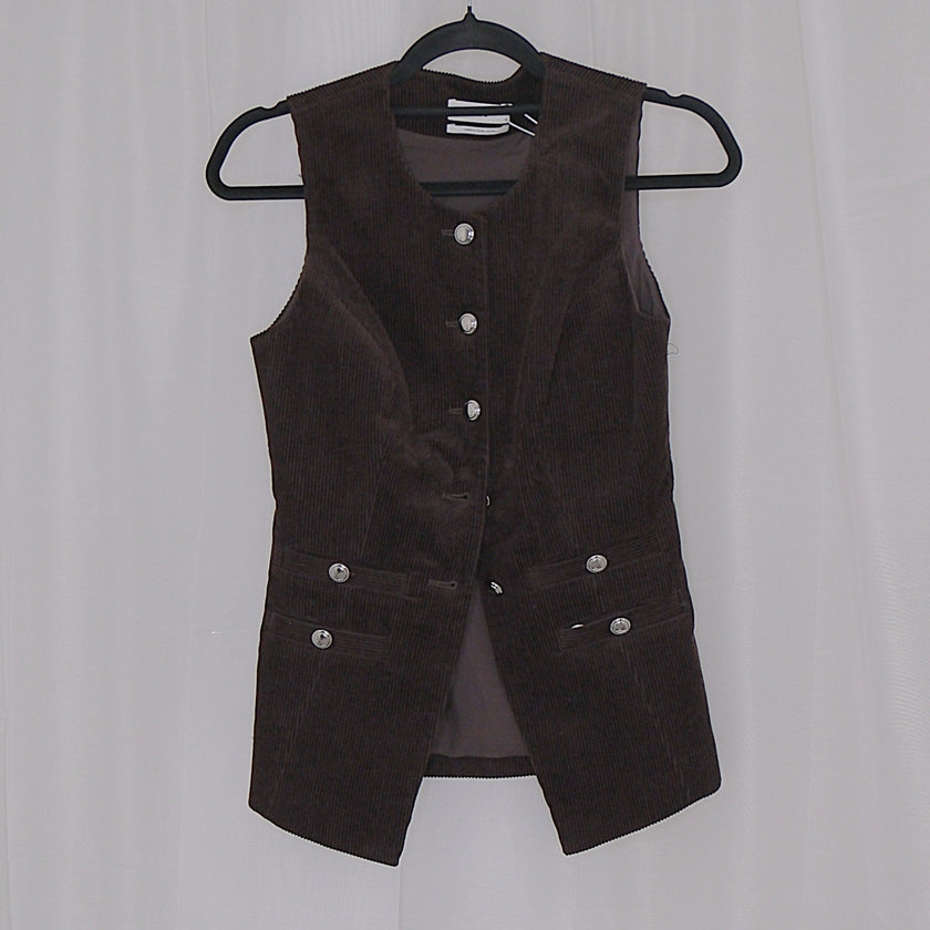 Chocolate corduroy vest and skirt set on hangers against a white background