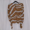 Leopard print top on a hanger against a plain background
