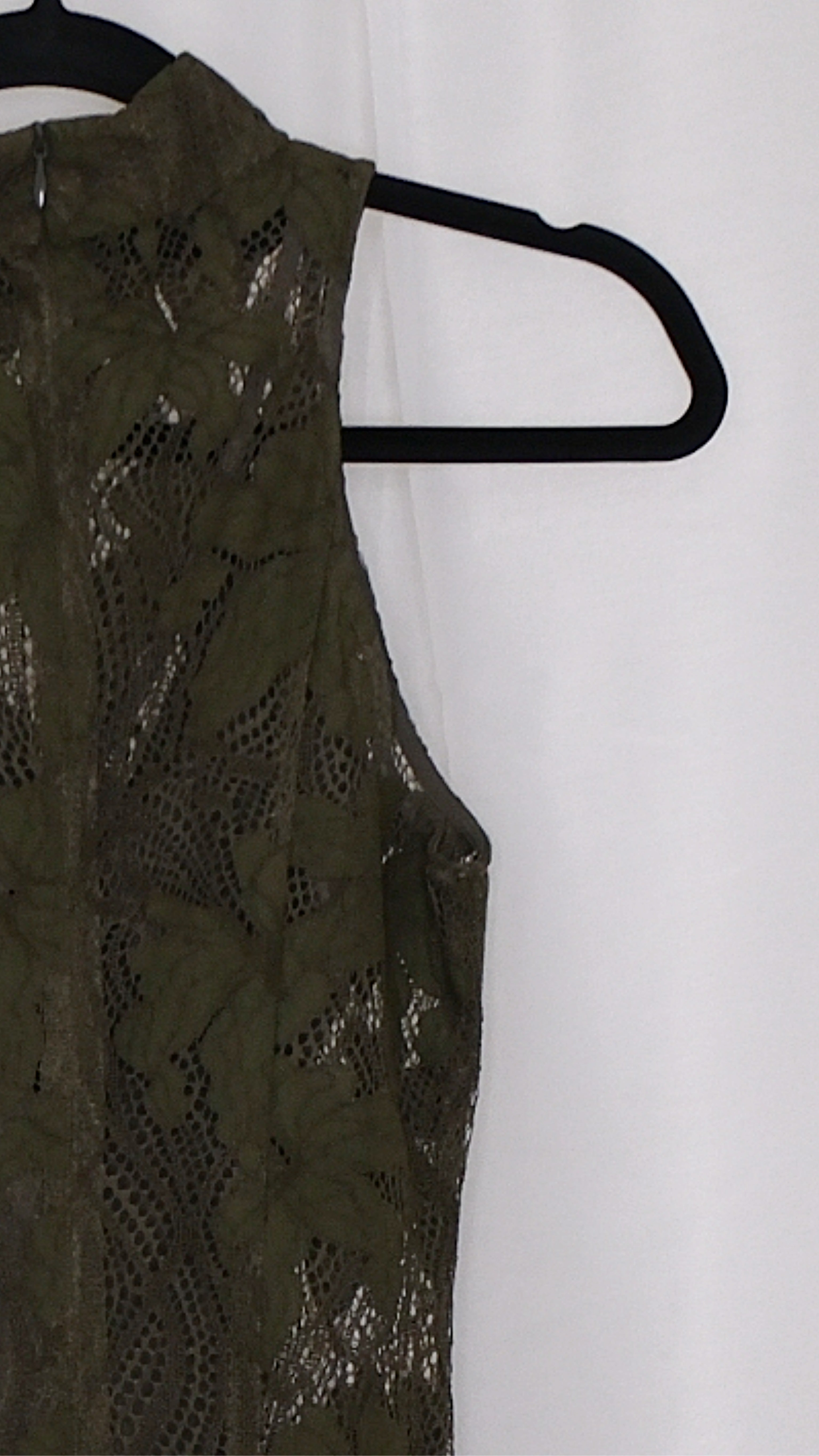 Olive green lace dress on a hanger against a white background