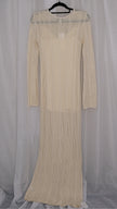 Beige long-sleeve crochet dress on a hanger against a light white background
