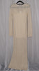 Beige long-sleeve crochet dress on a hanger against a light white background