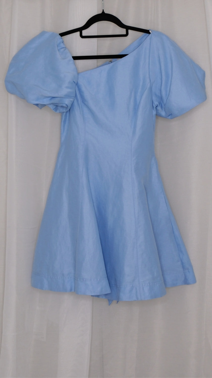 Light blue dress with puff sleeves on a hanger against a white background