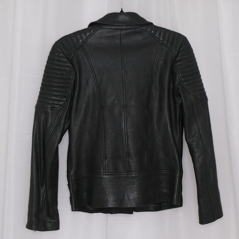 Black leather jacket with gold zippers on a white background
