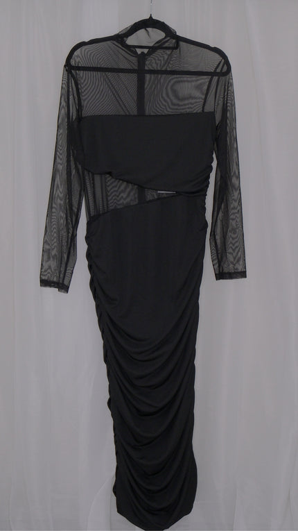 Black mesh dress with sheer sleeves on a hanger against a white background