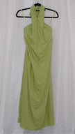 Green halter neck dress on a hanger against a white background