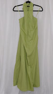 Green halter neck dress on a hanger against a white background