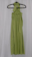 Green halter neck dress on a hanger against a white background