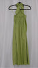 Green halter neck dress on a hanger against a white background